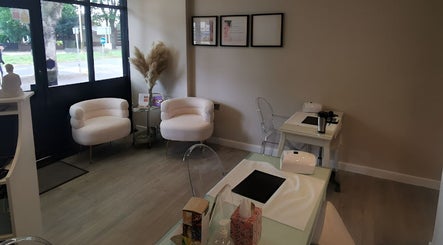 Elegant waiting area with cozy chairs at Vanity, Leicester, England, GB, offering a calming ambiance.