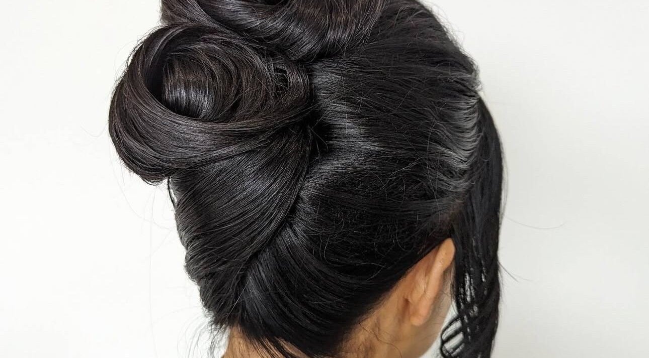 Stylish updo hairstyle at RMS Cosmetic Clinic in Liverpool, England, GB. Ideal for elegance and beauty.