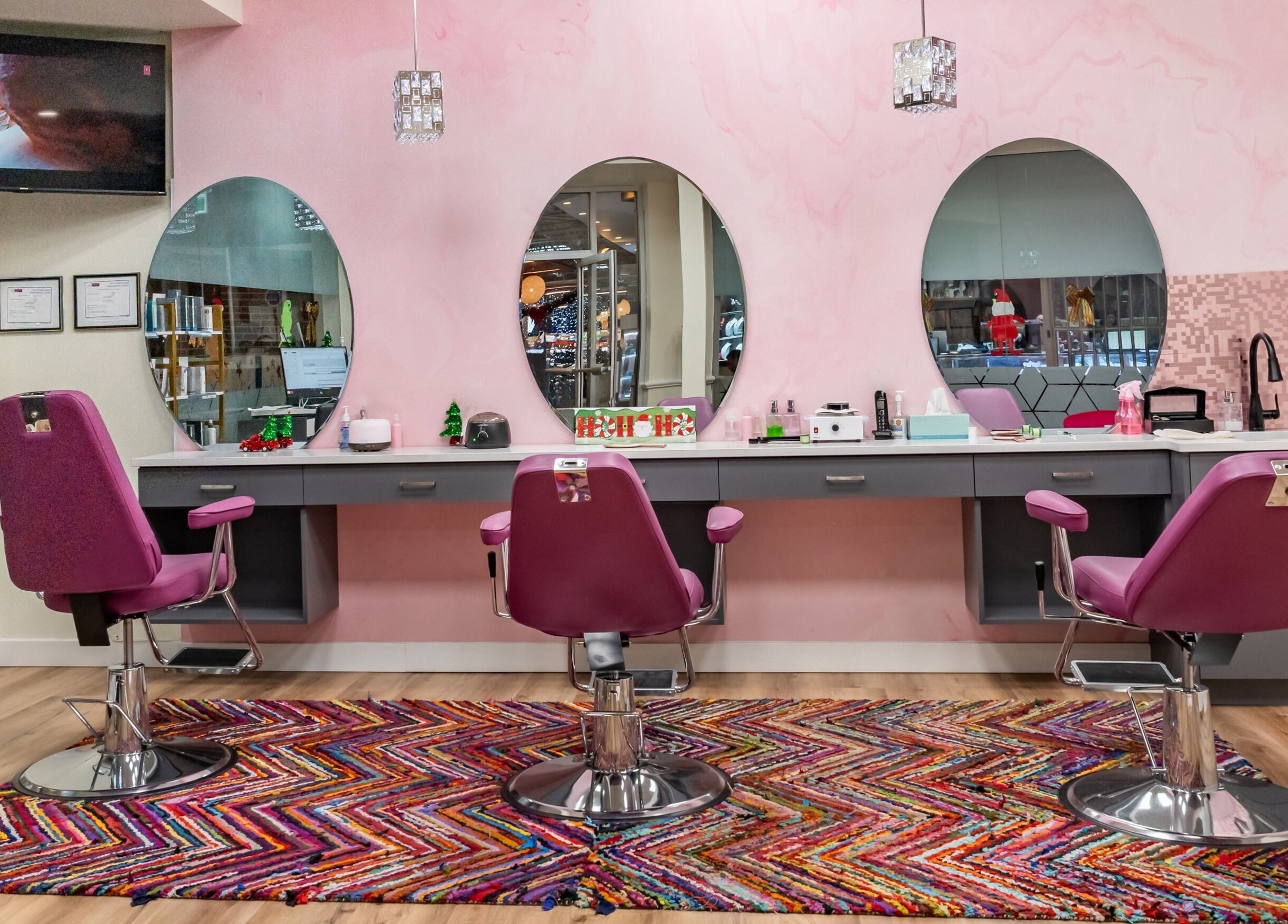 Modern salon interior at Namaste Beauty, Maple Ridge #330, British Columbia, CA, featuring stylish pink chairs.