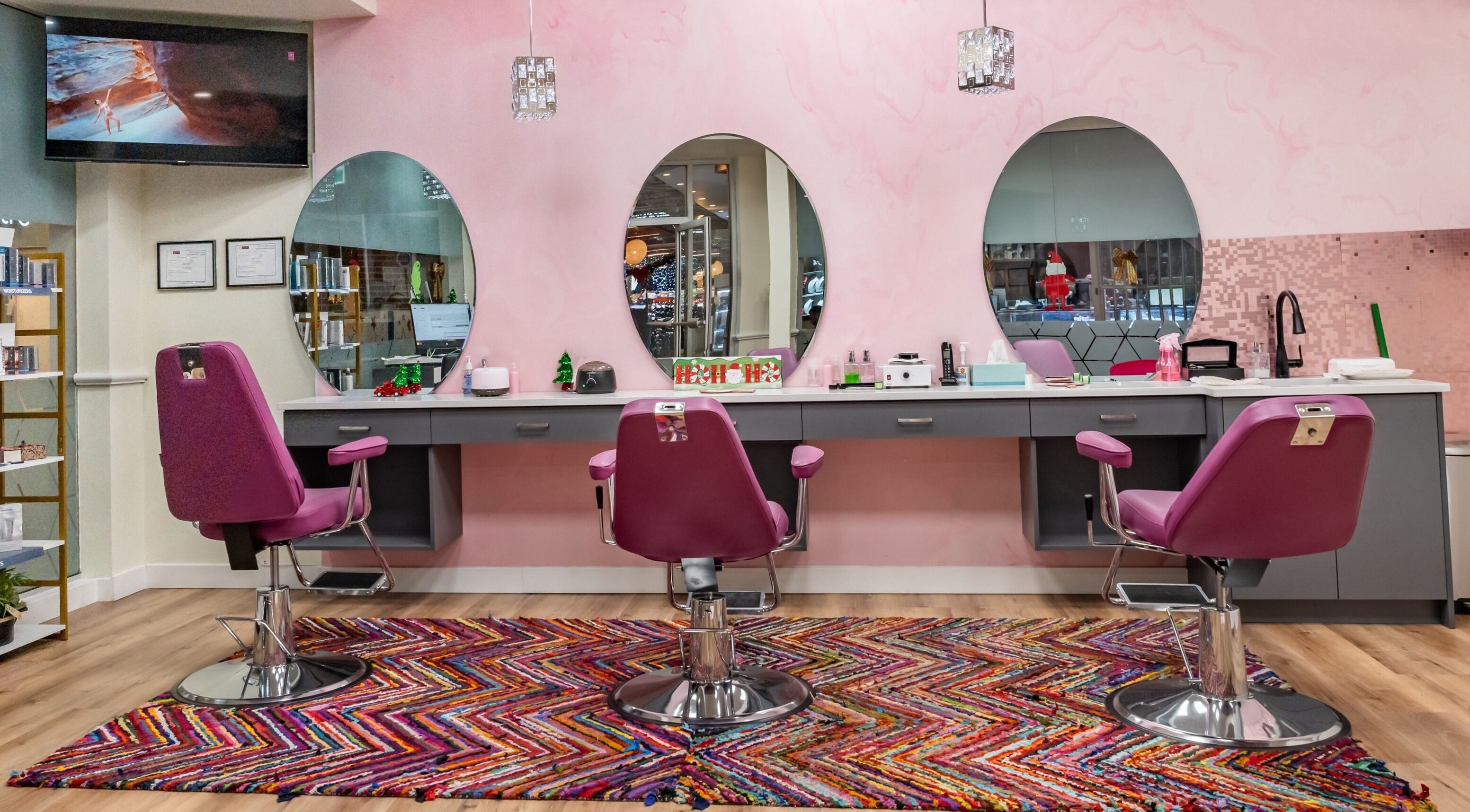 Modern salon interior at Namaste Beauty, Maple Ridge #330, British Columbia, CA, featuring stylish pink chairs.