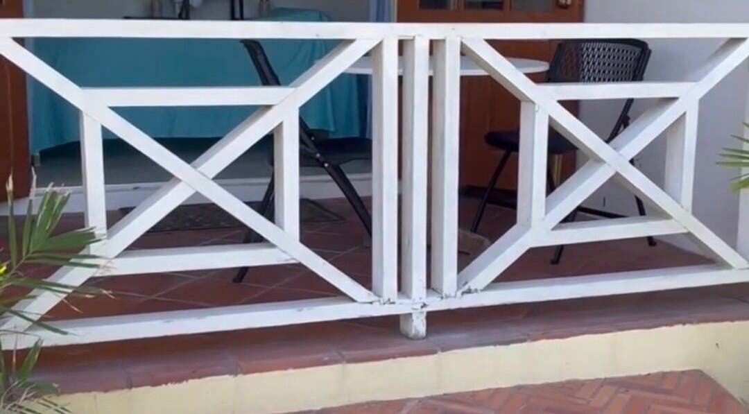 Stylish patio entrance at Khulula Therapy, Saint James, BB, showcasing cozy outdoor setting.