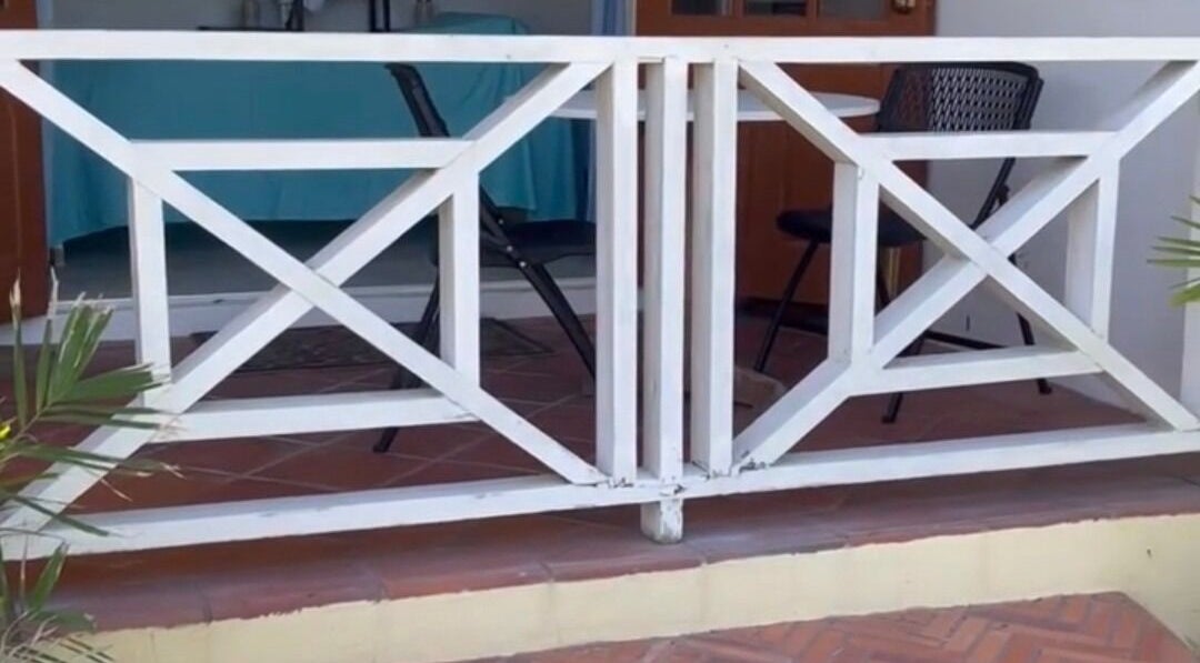 Stylish patio entrance at Khulula Therapy, Saint James, BB, showcasing cozy outdoor setting.