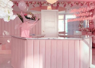 AM Beauty's pink-themed reception in Kuala Lumpur, Wilayah Persekutuan, MY, featuring floral decor and seating.