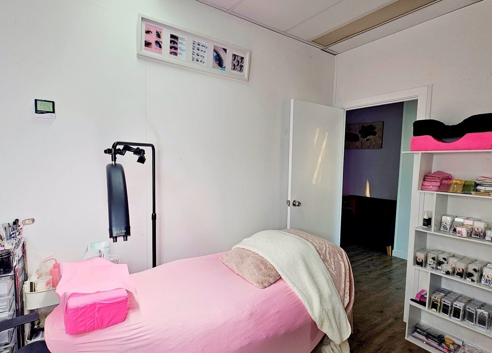 Cozy treatment room at Lun's Beauty and Massage Spa in Redcliffe, Queensland, AU, with pink decor and beauty tools.