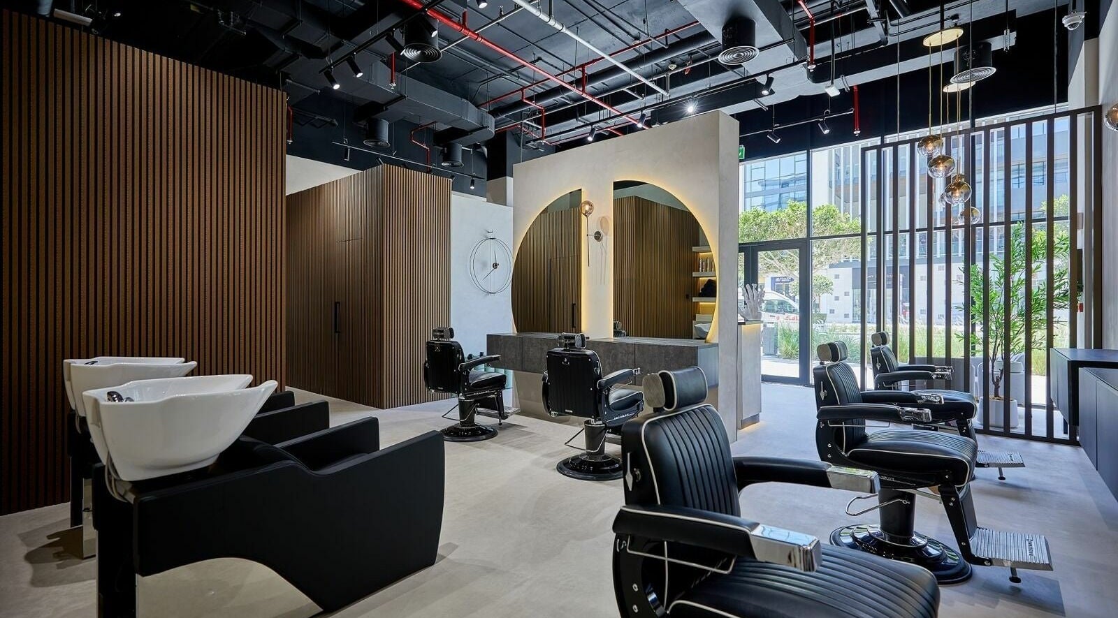 Modern interior of Jalal Hafed Gents Salon in Dubai, Dubai, AE, featuring elegant chairs and sleek design.