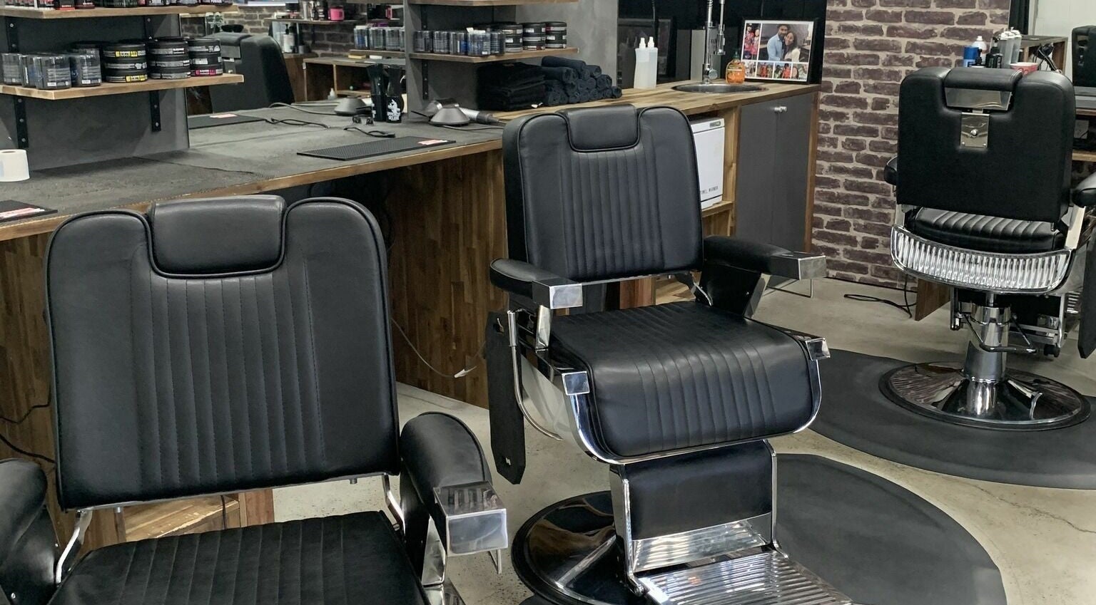 Barber chairs at Lole's Barber Shop - Commercial Drive in Springfield, Queensland, AU showcasing modern style.