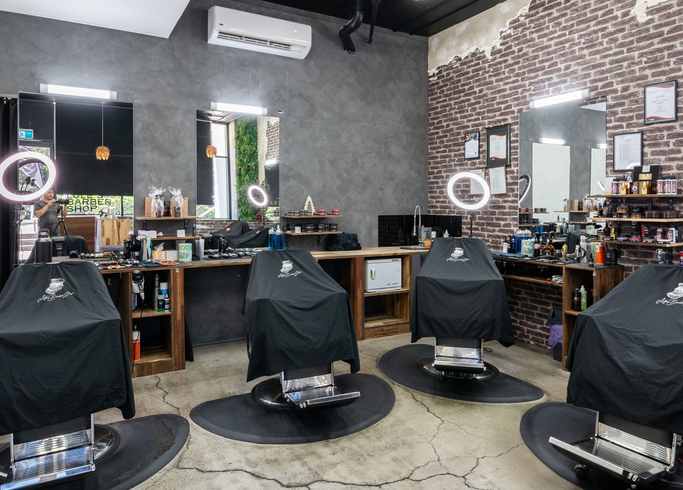 Interior of Lole's Barber Shop - Ian Keilar Drive, Springfield Central, QLD, AU showcasing elegant barber chairs.
