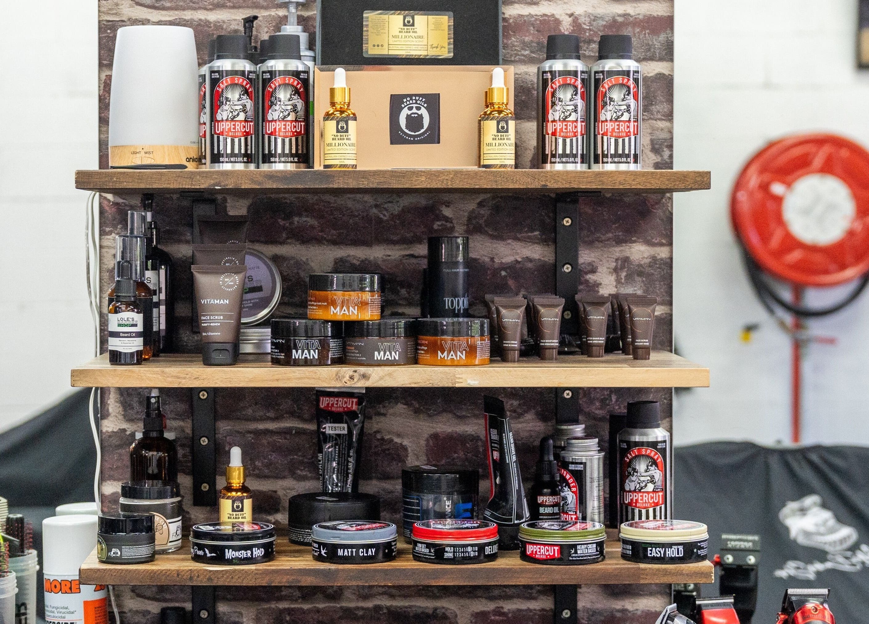 Grooming products at Lole's Barber Shop - Ian Keilar Drive, Springfield Central, QLD, AU neatly displayed on shelves.