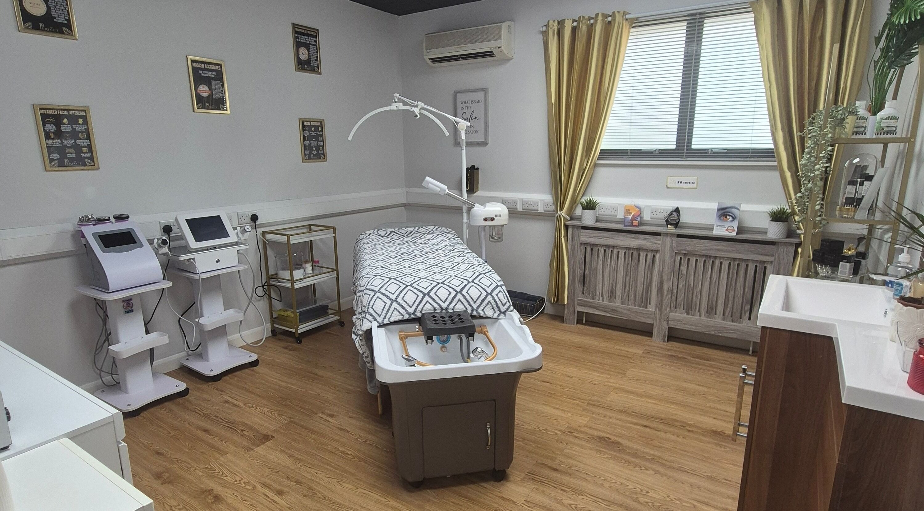 Treatment room at Perfect Piercings, Skin and Laser Clinic, Saint Neots, England, offering modern beauty services.