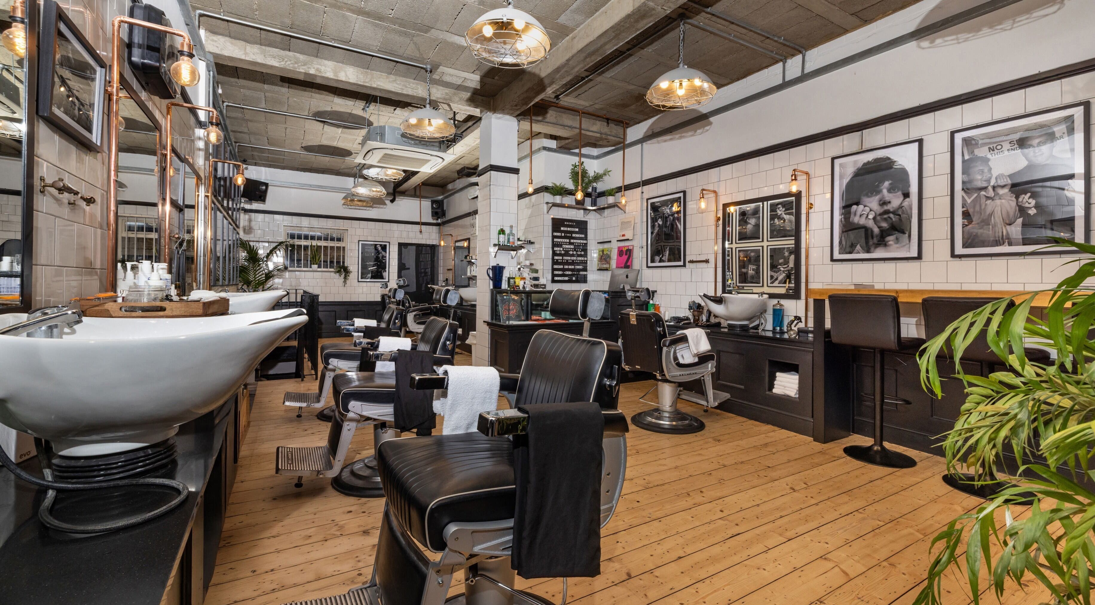 Chic interior of Huckle Lambs Conduit Street, a stylish barbershop in London, England, GB.
