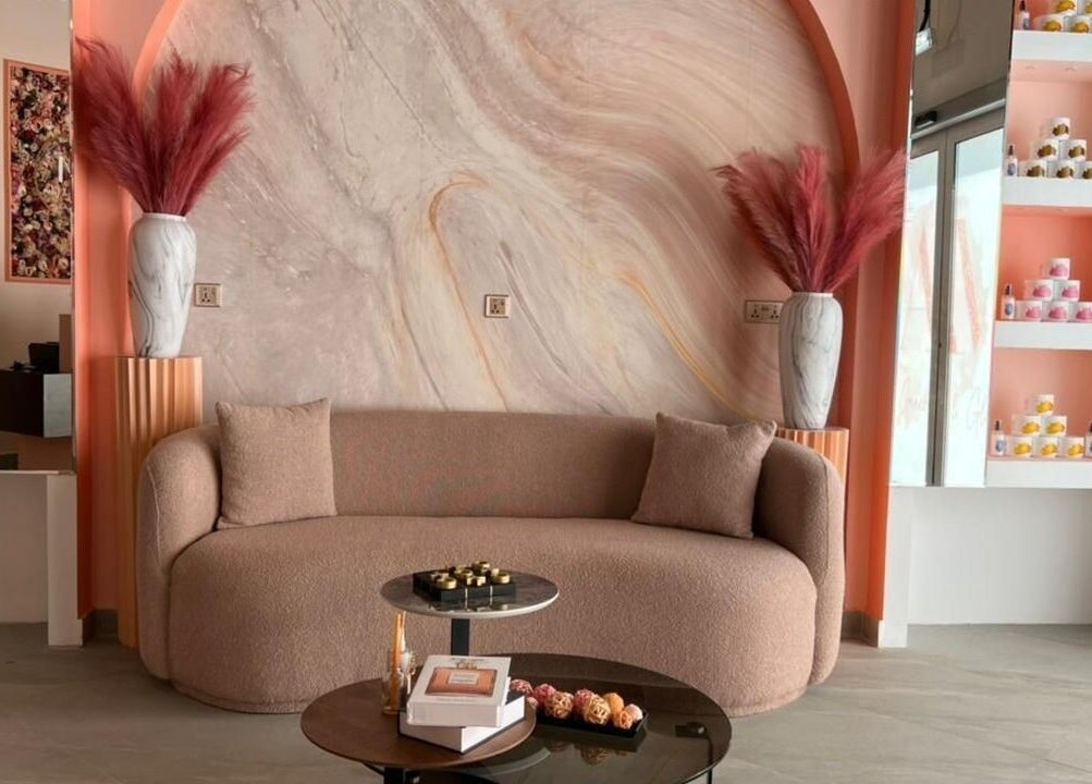 Chic interior of Am Grace & Glam Beauty Center Arjan Dubai, vibrant decor and cozy seating, Dubai, AE.