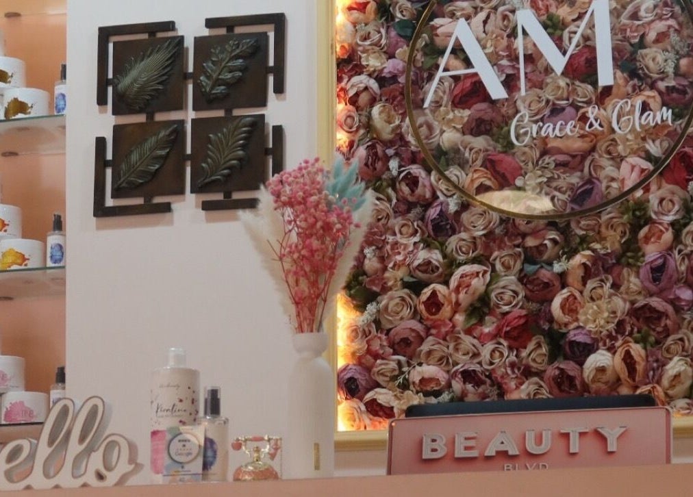 Interior view of Am Grace & Glam Beauty Center Arjan Dubai showcasing floral wall decor in Dubai, AE.