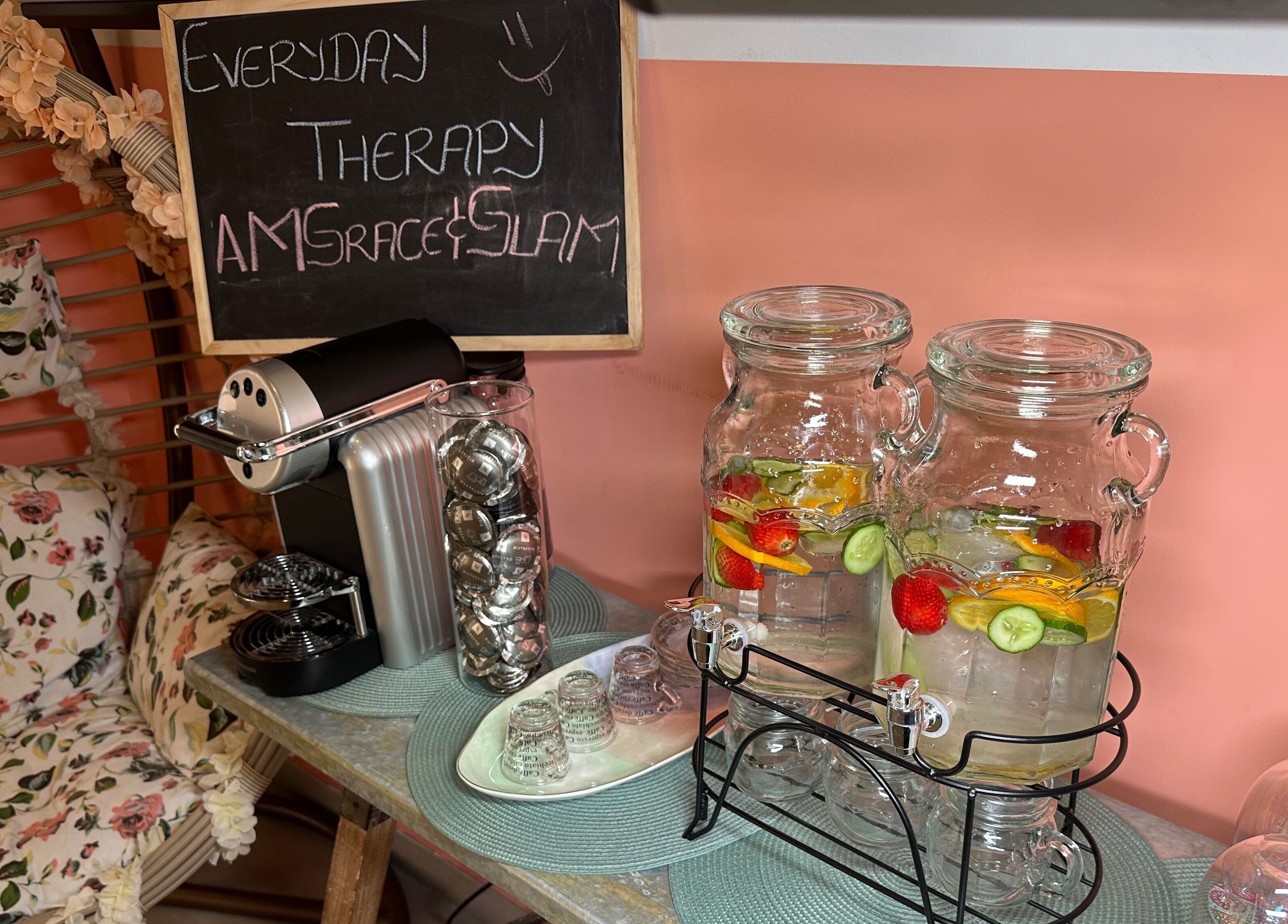 Cozy setup at Am Grace & Glam Beauty Center Arjan Dubai, Dubai, AE with coffee and infused water.