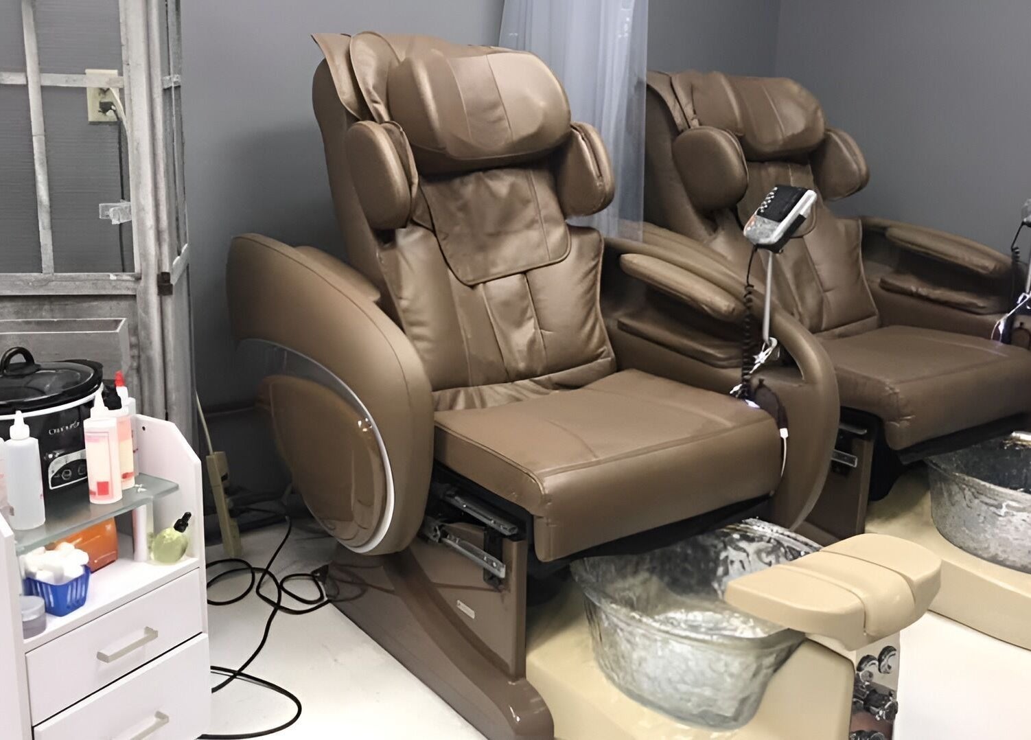 Comfortable pedicure chairs at The Walk-In Salon, Elkhart, Indiana, US, offering a relaxing experience.