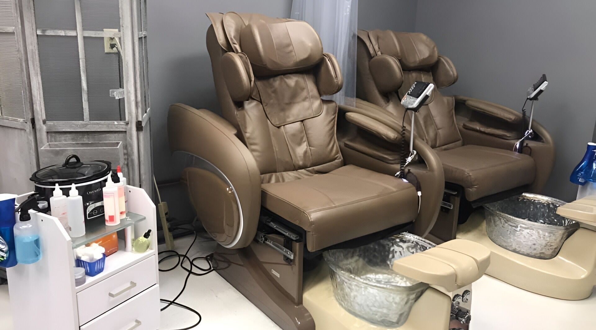 Comfortable pedicure chairs at The Walk-In Salon, Elkhart, Indiana, US, offering a relaxing experience.