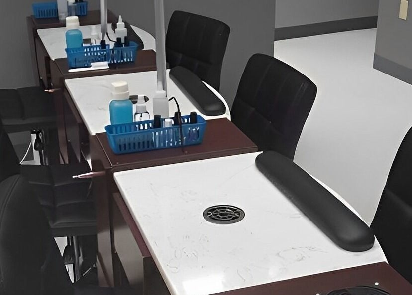 Elegant nail station at The Walk-In Salon, Elkhart, Indiana, US, featuring comfortable chairs and manicure tools.