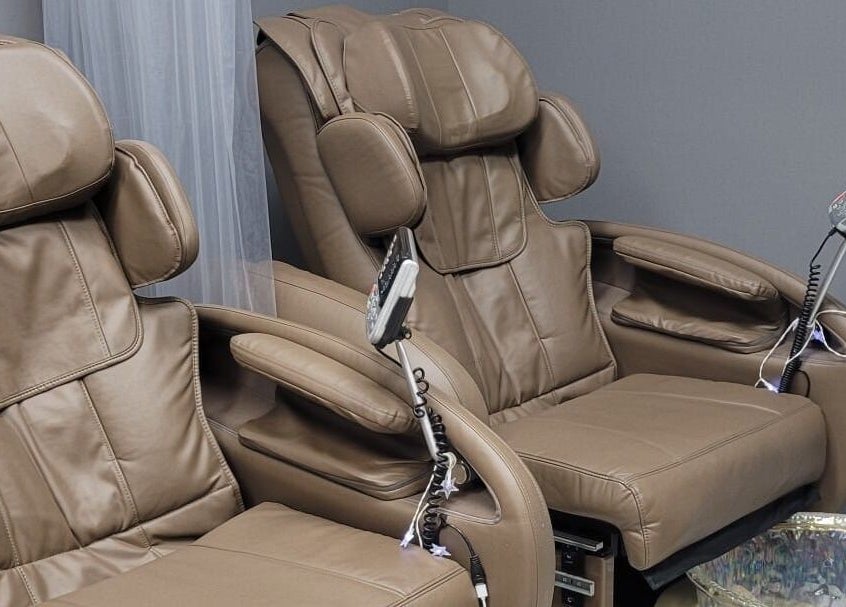 Comfortable massage chairs at The Walk-In Salon, Elkhart, Indiana, US offering a relaxing experience.