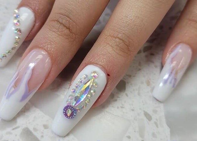 Intricate nail art with gems at The Walk-In Salon, Elkhart, Indiana, US.