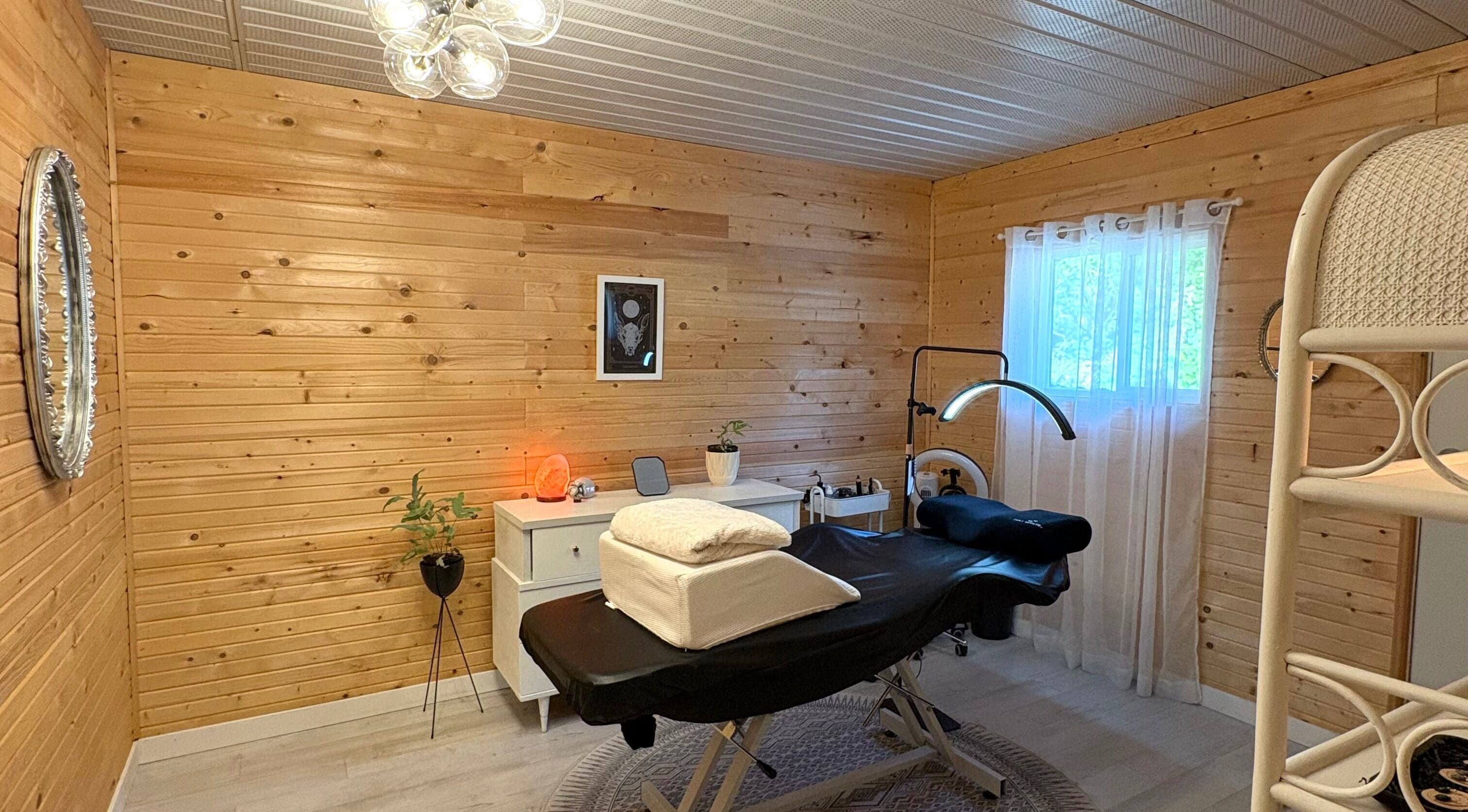 Relaxing therapy room at Moon Island Co., Royston, British Columbia, CA with massage table and serene decor.