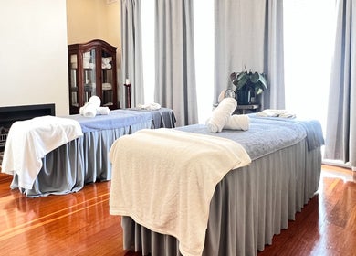 Relaxing massage room at MRB Massage Therapy, Melbourne, Victoria, AU, showcasing two inviting therapy tables.