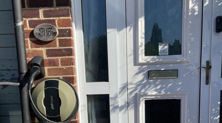 Front entrance of Ascot ART of Healing, Winkfield Row, England showcasing elegant brickwork and door.