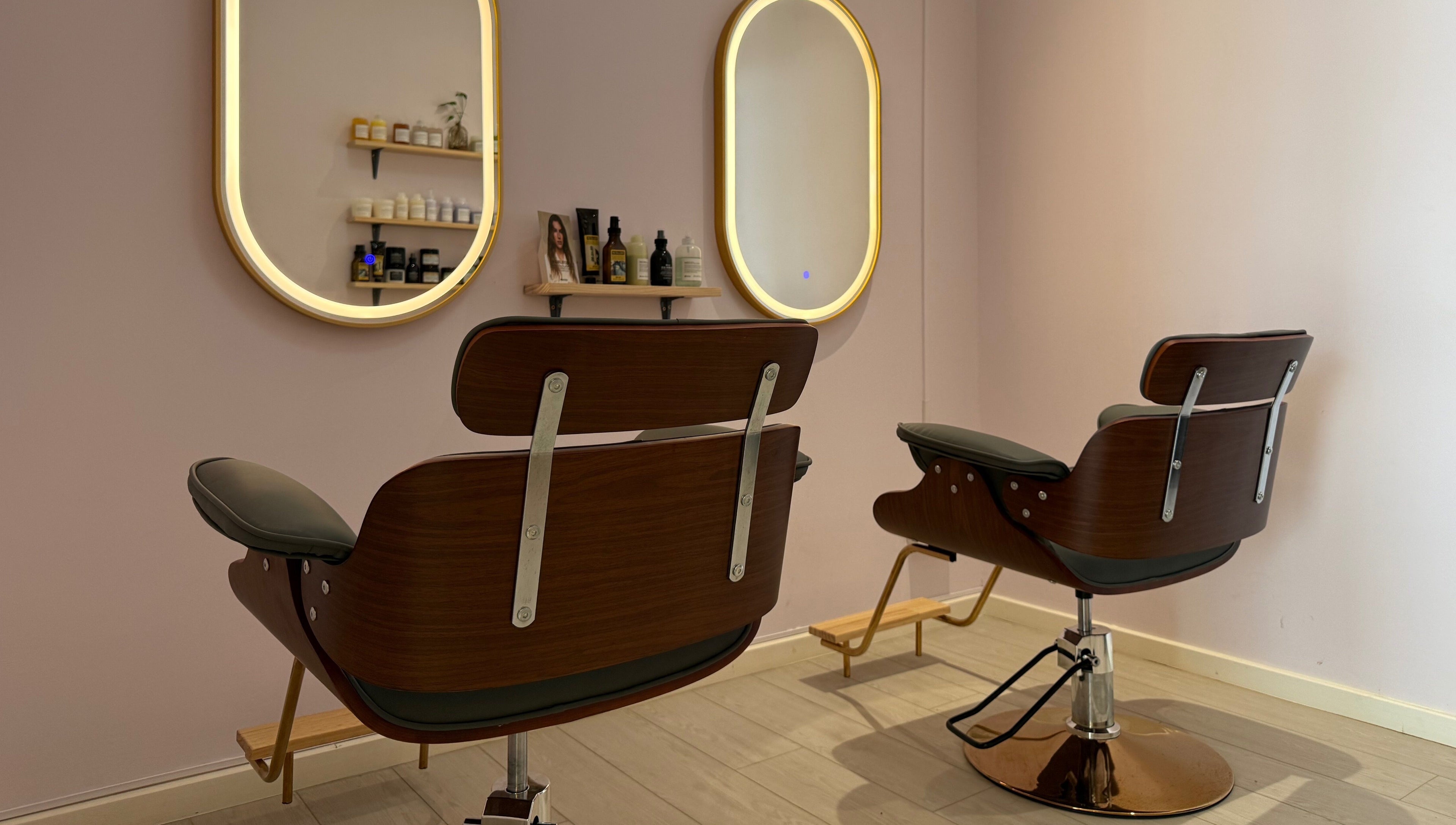 Stylish salon chairs at La Maison Beauté by K, Moka, Moka District, MU. Elegant mirrors and product display in view.