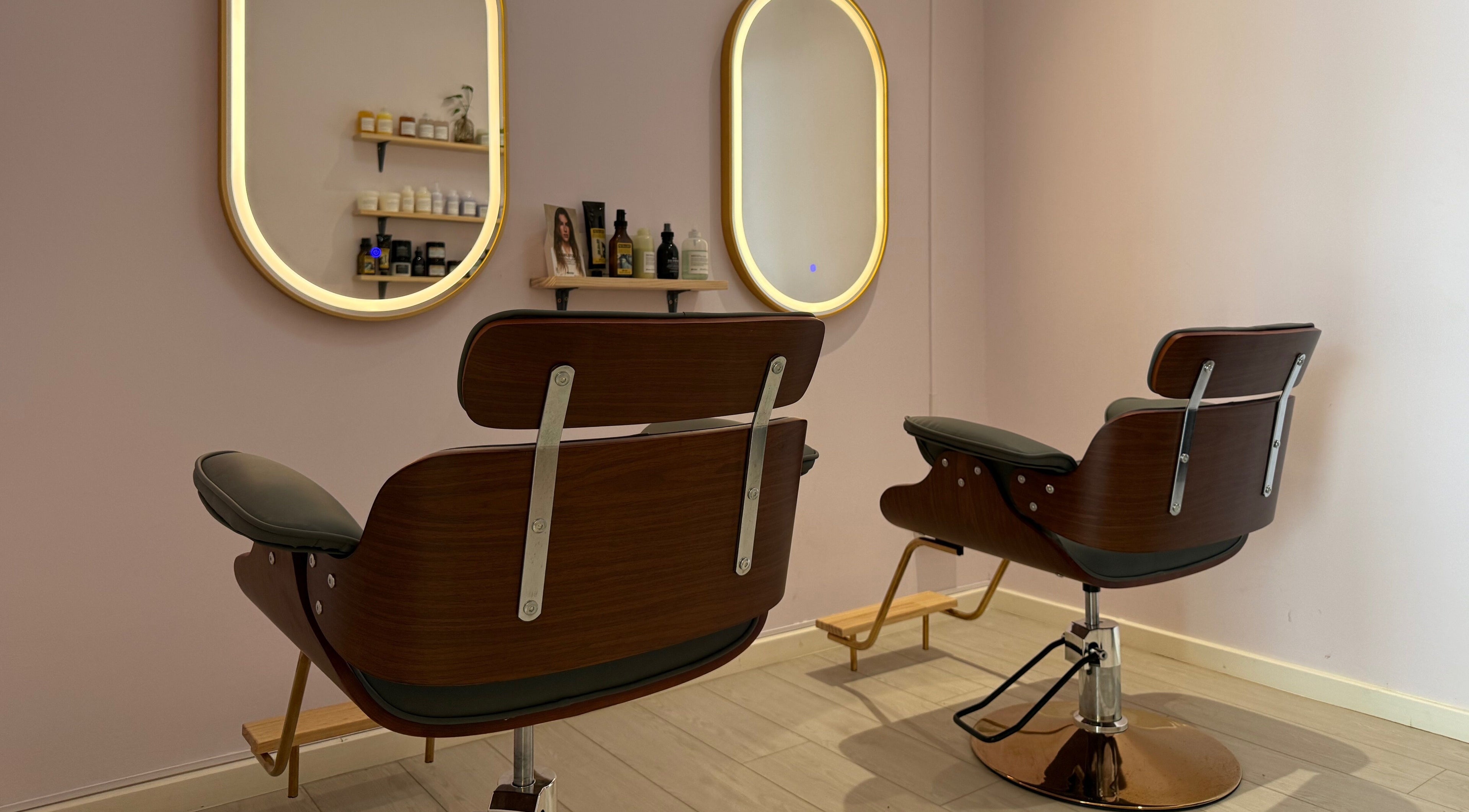 Stylish salon chairs at La Maison Beauté by K, Moka, Moka District, MU. Elegant mirrors and product display in view.