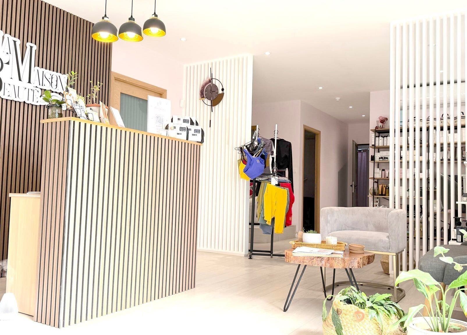 Chic reception area of La Maison Beauté by K in Moka, Moka District, MU, featuring modern decor and plants.