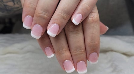 Elegant French manicure at Erica's Salon & Spa in Monterey, Tennessee, US, showcasing refined nail art.