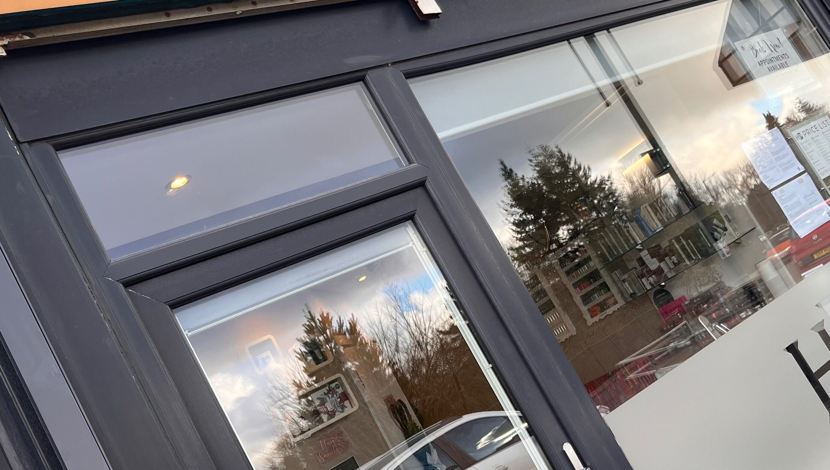 Front view of Adriennes Aesthetics Ltd entrance in Clarkston, Scotland, GB showcasing modern window design.