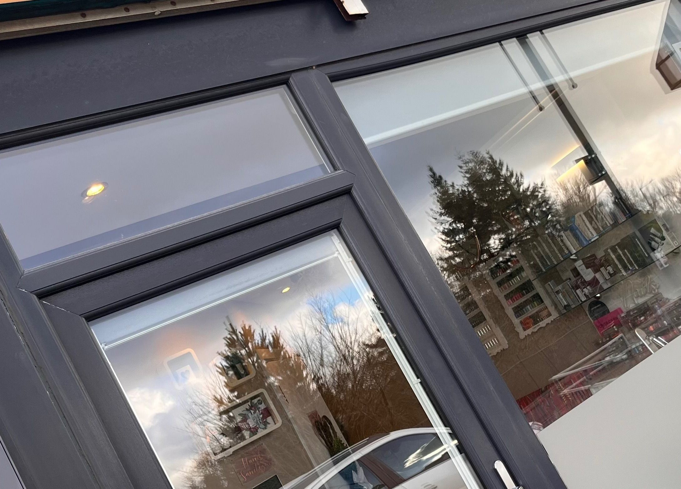 Front view of Adriennes Aesthetics Ltd entrance in Clarkston, Scotland, GB showcasing modern window design.