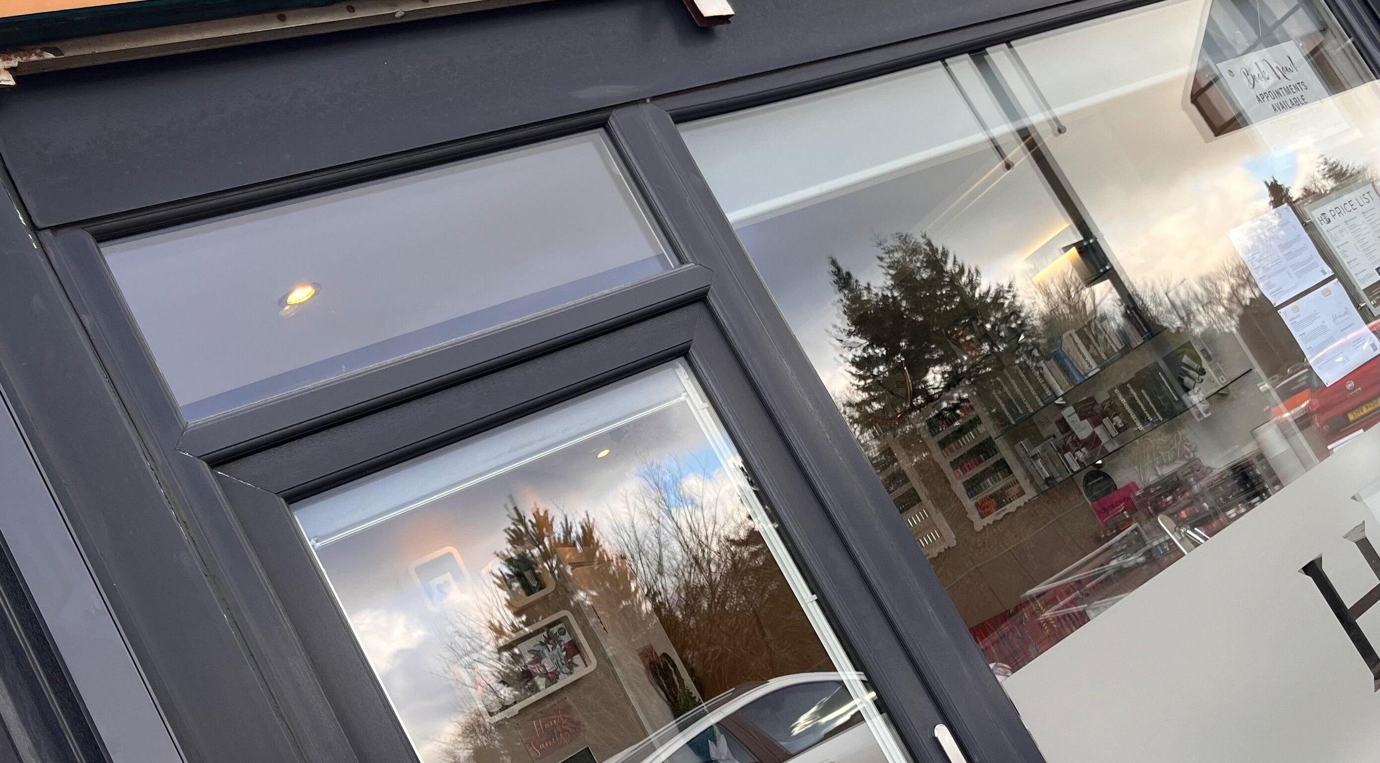 Front view of Adriennes Aesthetics Ltd entrance in Clarkston, Scotland, GB showcasing modern window design.