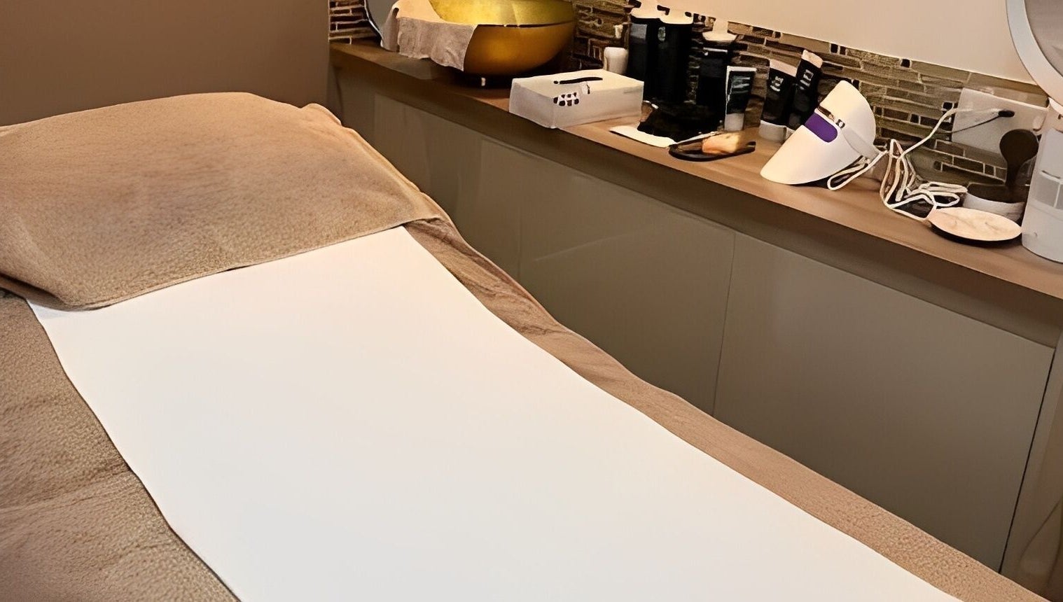 Relaxation treatment room at Adriennes Aesthetics Ltd, Clarkston, Scotland, GB featuring a cozy massage table.