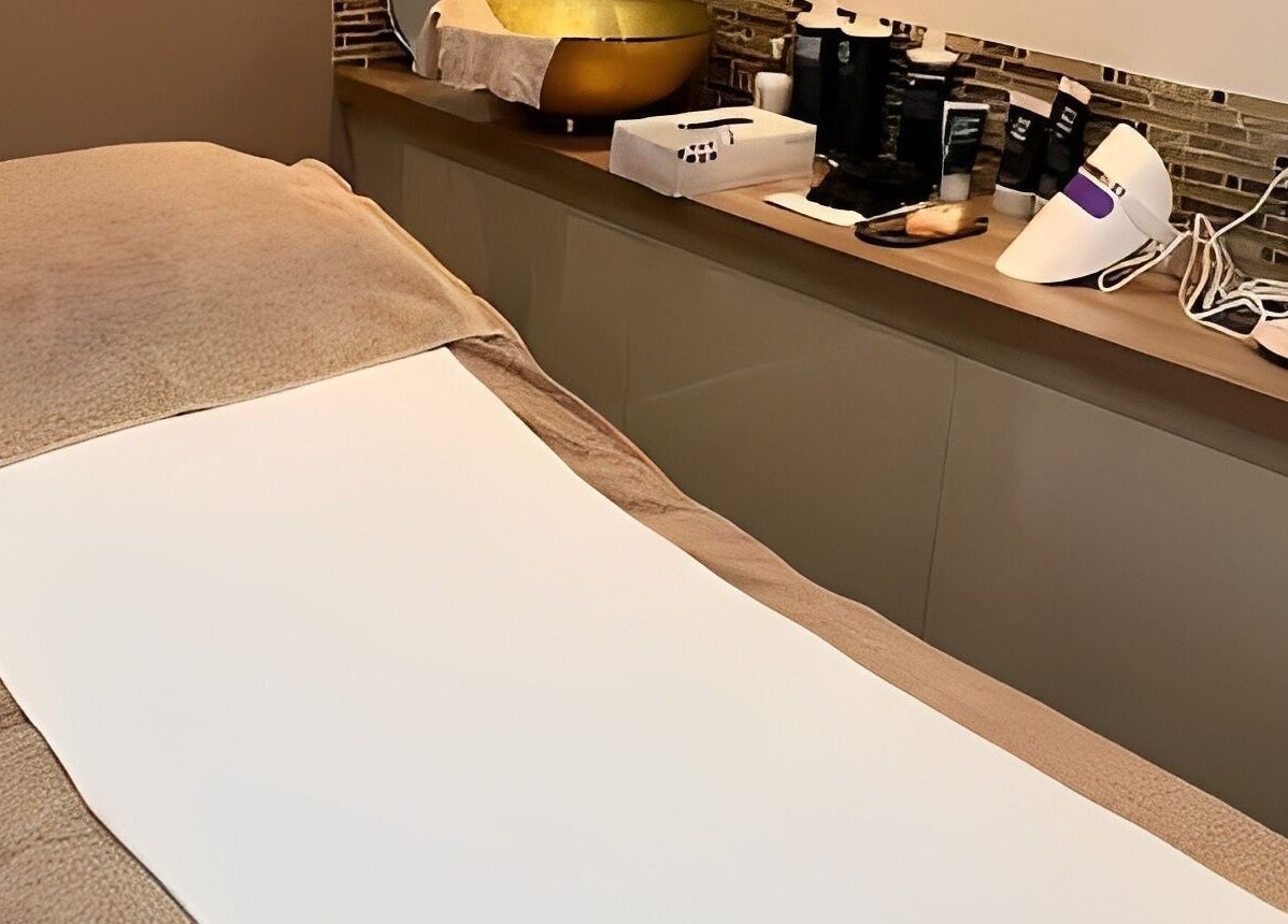 Relaxation treatment room at Adriennes Aesthetics Ltd, Clarkston, Scotland, GB featuring a cozy massage table.