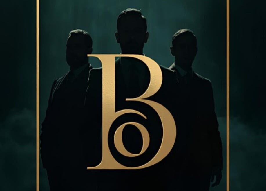 Stylish silhouettes behind golden B logo at BLACK OAK, Peoria, Illinois, US.