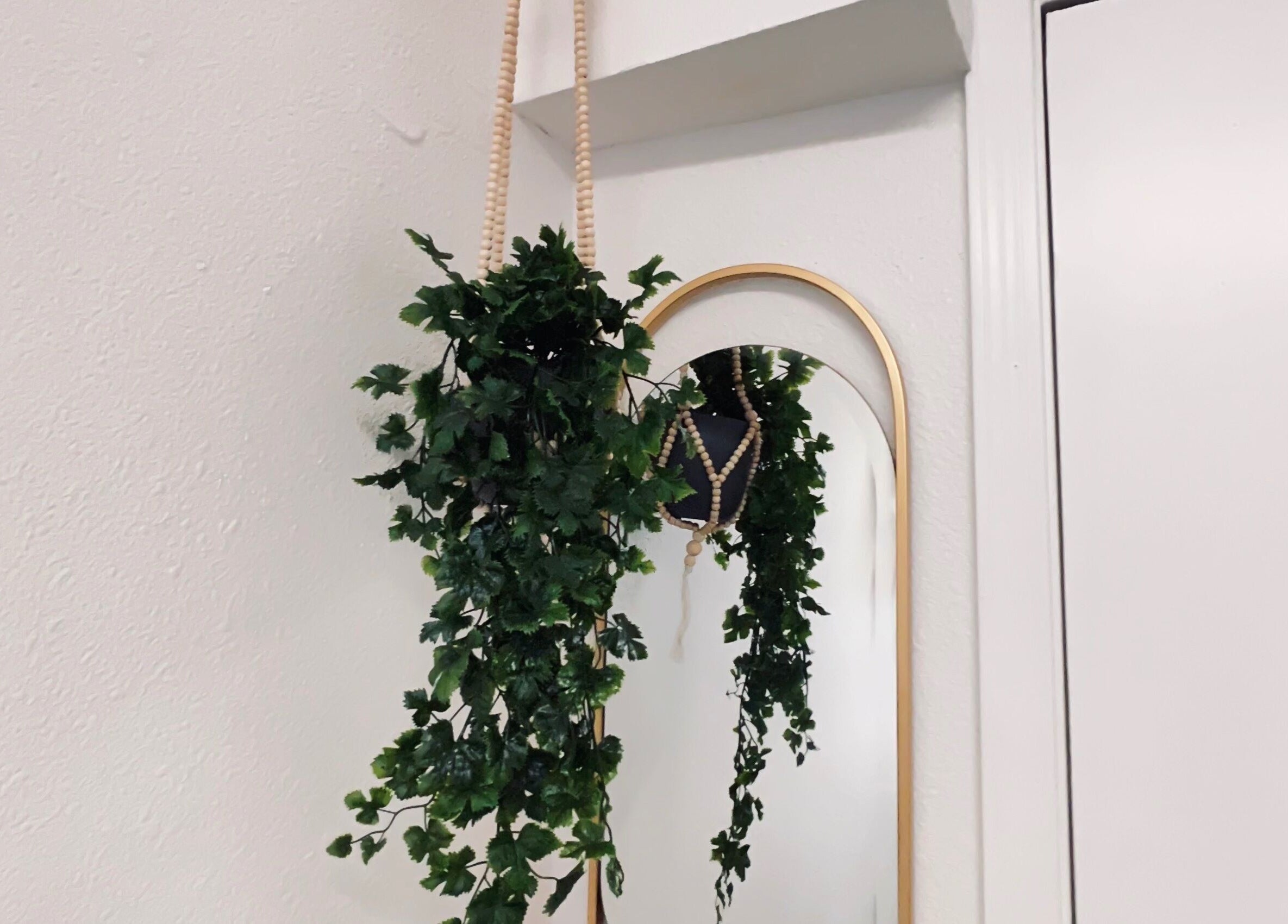 Hanging greenery and mirror at Flourish Beauty & Spa, Everett, Washington, US.