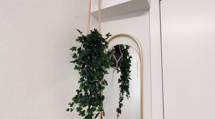 Hanging greenery and mirror at Flourish Beauty & Spa, Everett, Washington, US.