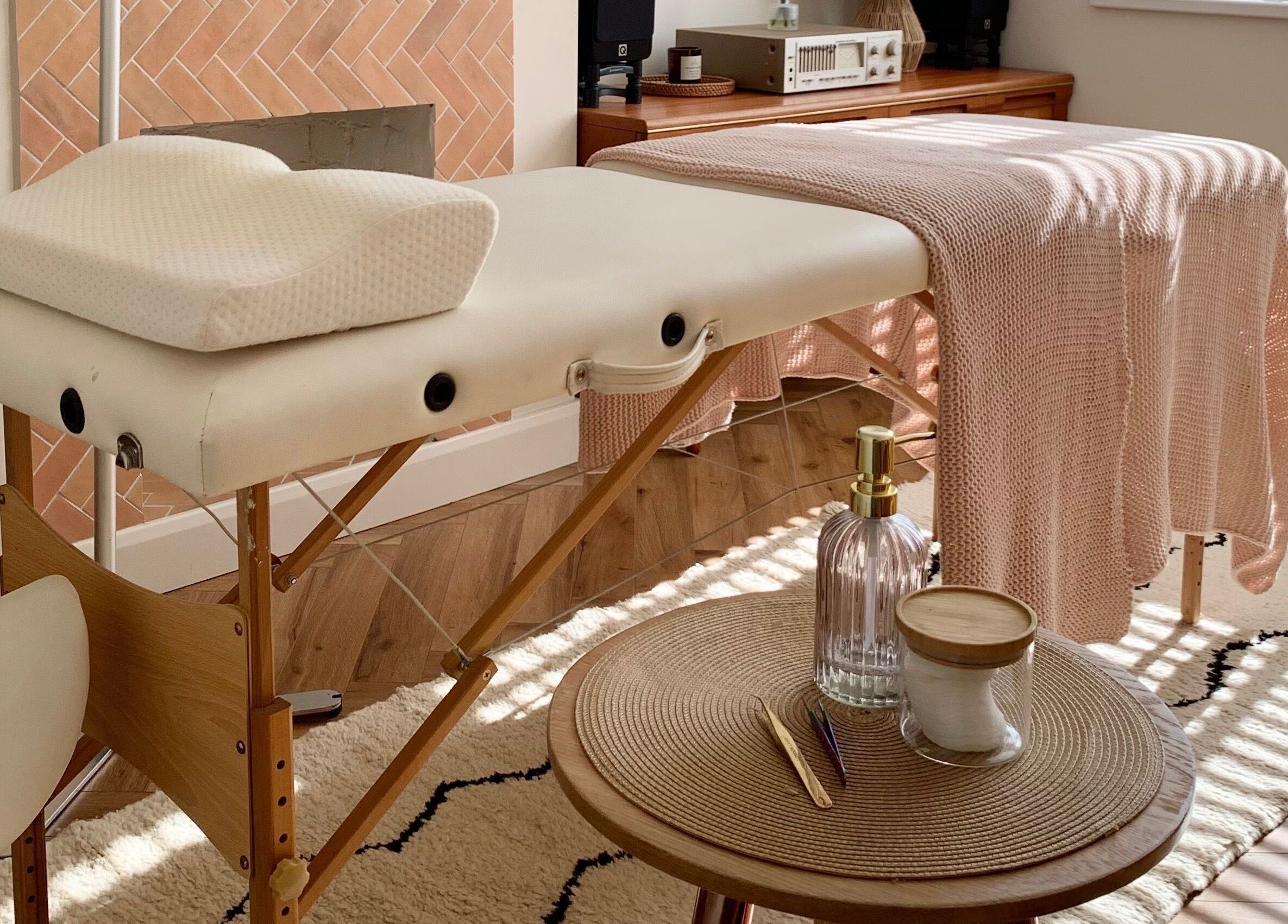 Serene therapy table setup at Lashqueen York, nestled in York, England, GB, with cozy knit blankets.