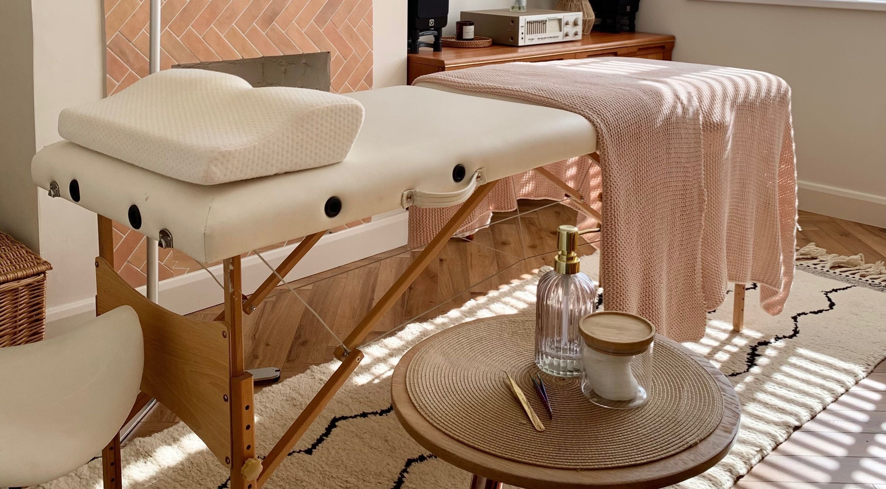 Serene therapy table setup at Lashqueen York, nestled in York, England, GB, with cozy knit blankets.