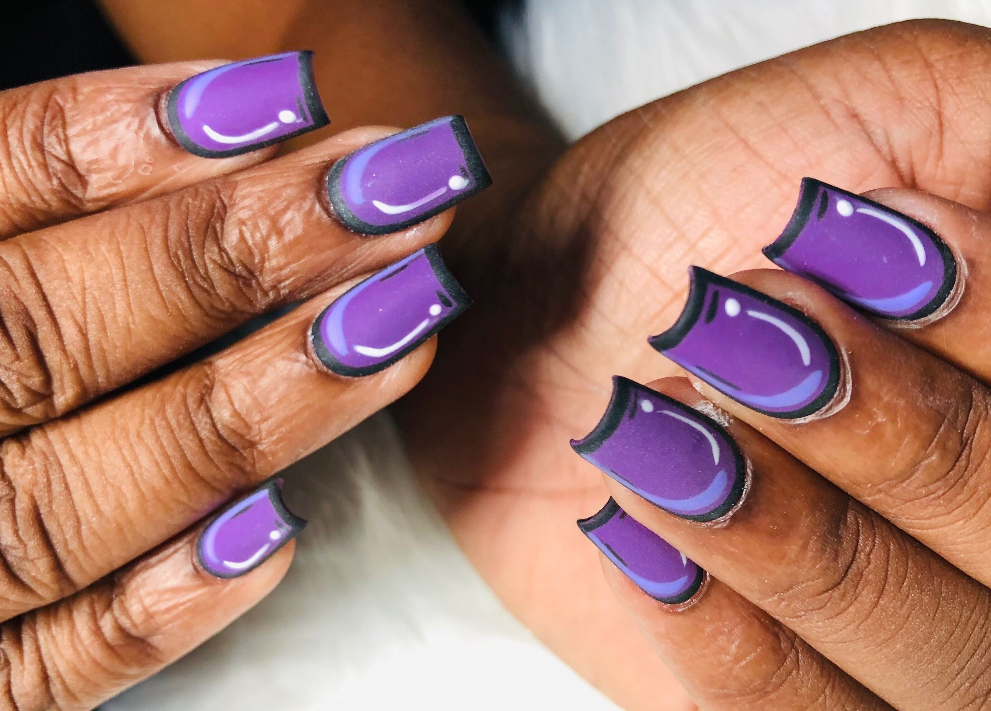 Elegant purple nail art at The Butterfly Nail Lounge, Bridgetown, Saint Peter, BB. Perfect for stylish occasions.