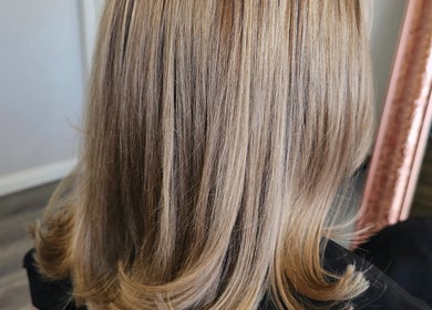 Elegant blonde hairstyle showcased at Tease by Jess in Mildura, Victoria, AU, enhances natural beauty.