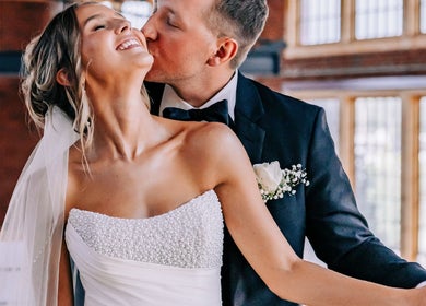 Bride and groom embrace joyfully at Meg You Glow, Heber City, Utah, US venue, capturing love and elegance.
