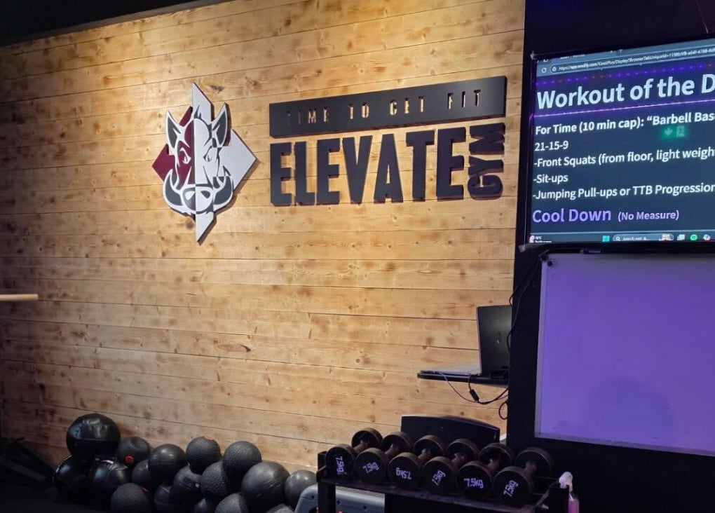 Interior of Elevate Gym + Athlete Recovery in Clogher, Northern Ireland, featuring workout details display.