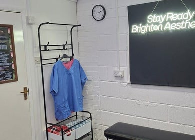 Reception area of Stay Ready Brighton Aesthetics in Brighton And Hove, England, GB with neon sign.