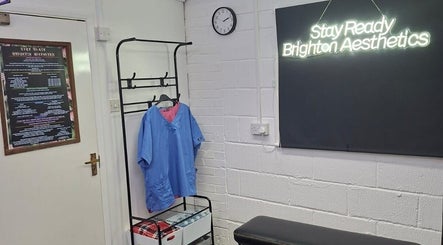 Reception area of Stay Ready Brighton Aesthetics in Brighton And Hove, England, GB with neon sign.