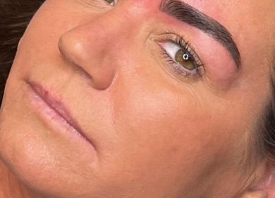 Close-up of a woman's freshly groomed eyebrows at The Glow Up, Blackpool, England, GB.