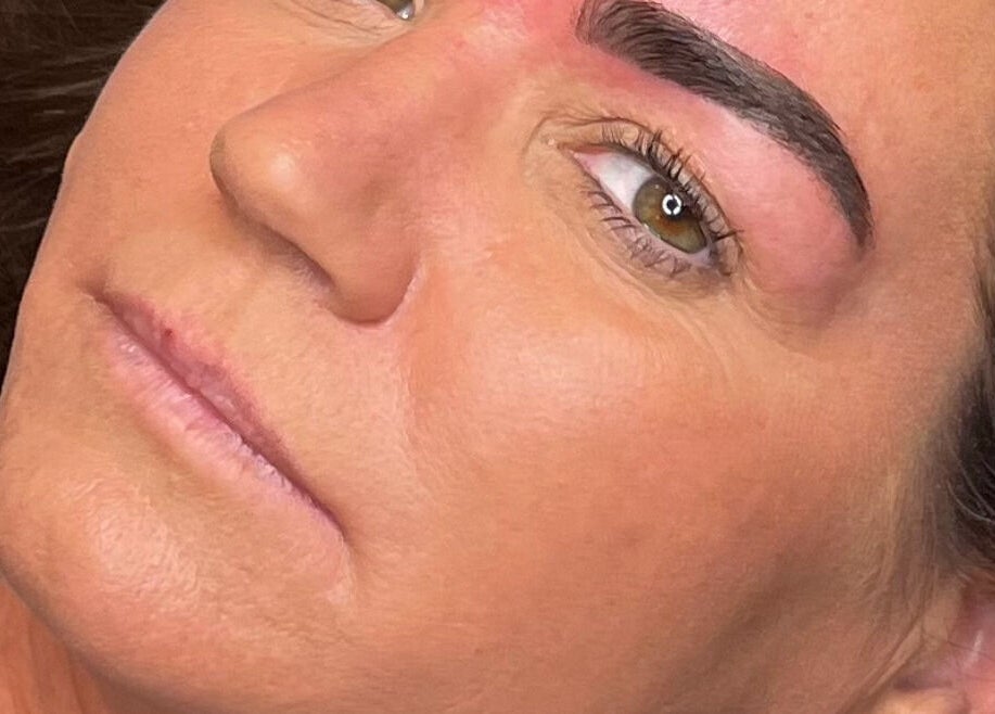 Close-up of a woman's freshly groomed eyebrows at The Glow Up, Blackpool, England, GB.