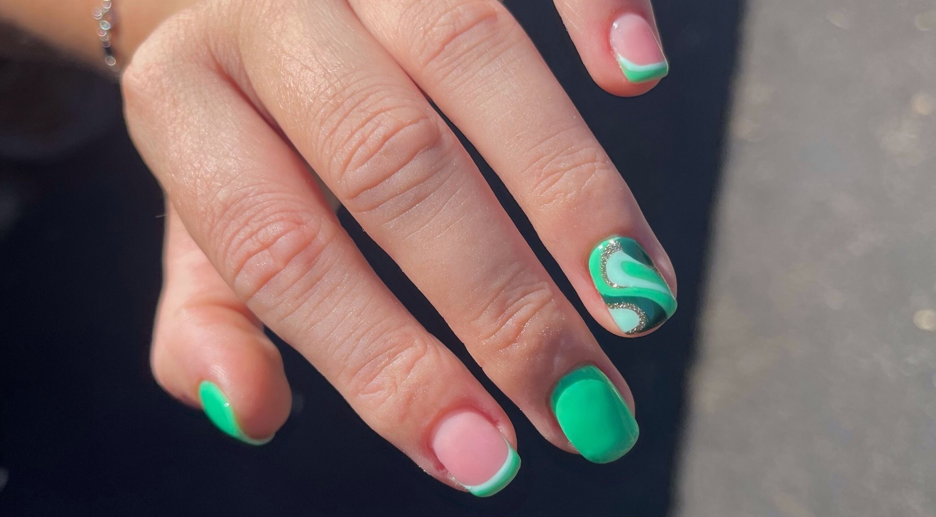 Stylish green and pink nail art at Serenity Studio, Great Canfield, England, GB enhancing fashion statement.