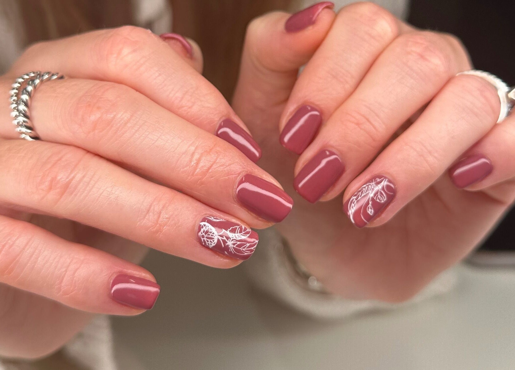 Beautiful manicure with intricate nail art at Serenity Studio, Great Canfield, England, GB.