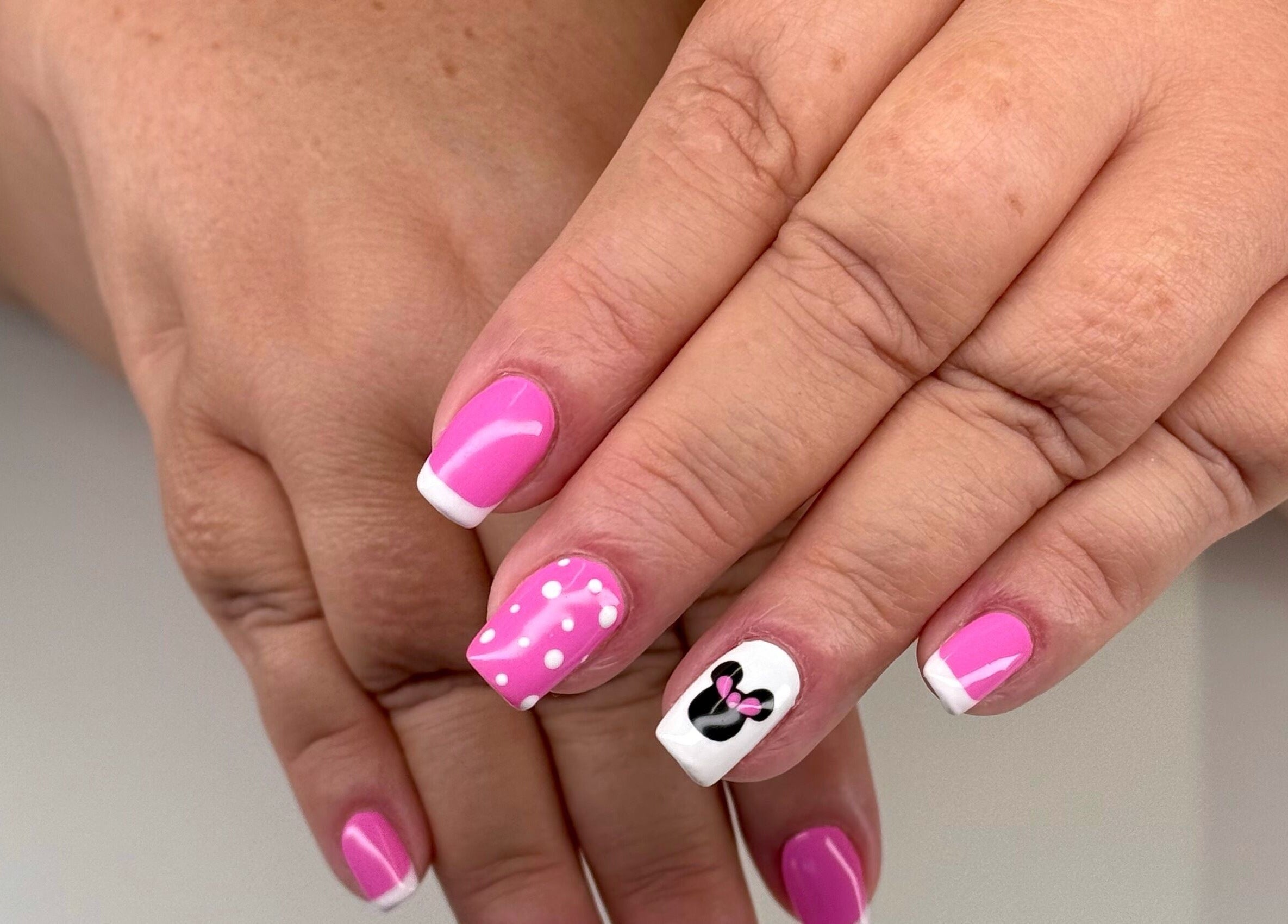 Pink and white nail art at Serenity Studio, Great Canfield, England, GB, showcasing elegance and creativity.